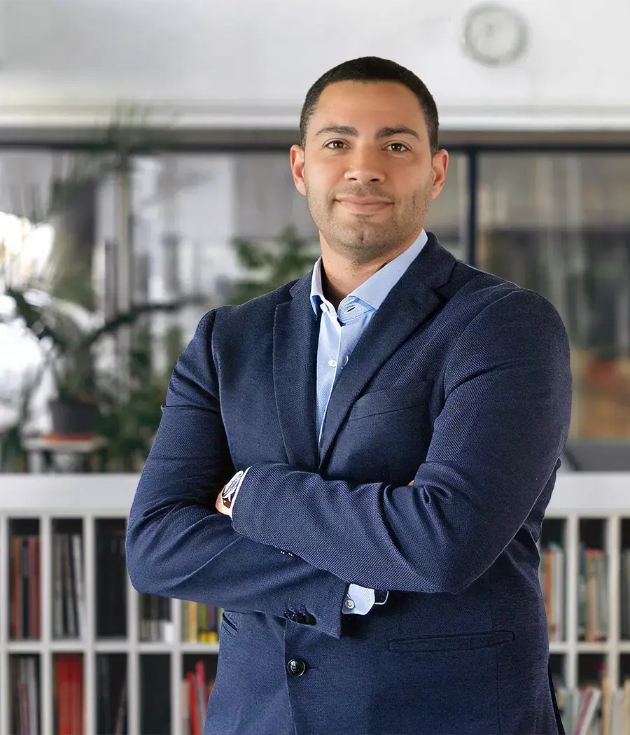 Real estate advisor in an office, supporting clients buying property in Portugal