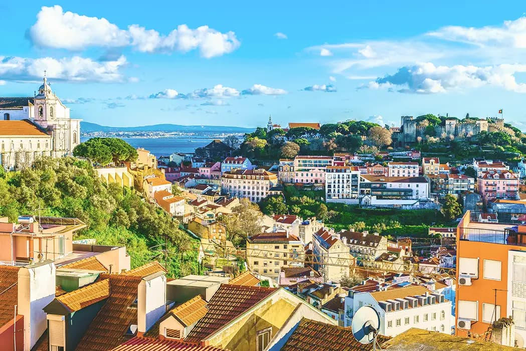 View from the Nossa Senhora do Monte viewpoint of the castle hill and part of the church of Our Lady of Grace in the Graça Neighborhood, Lisbon