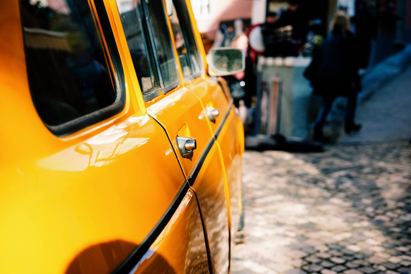 Yellow car on a Portuguese street.