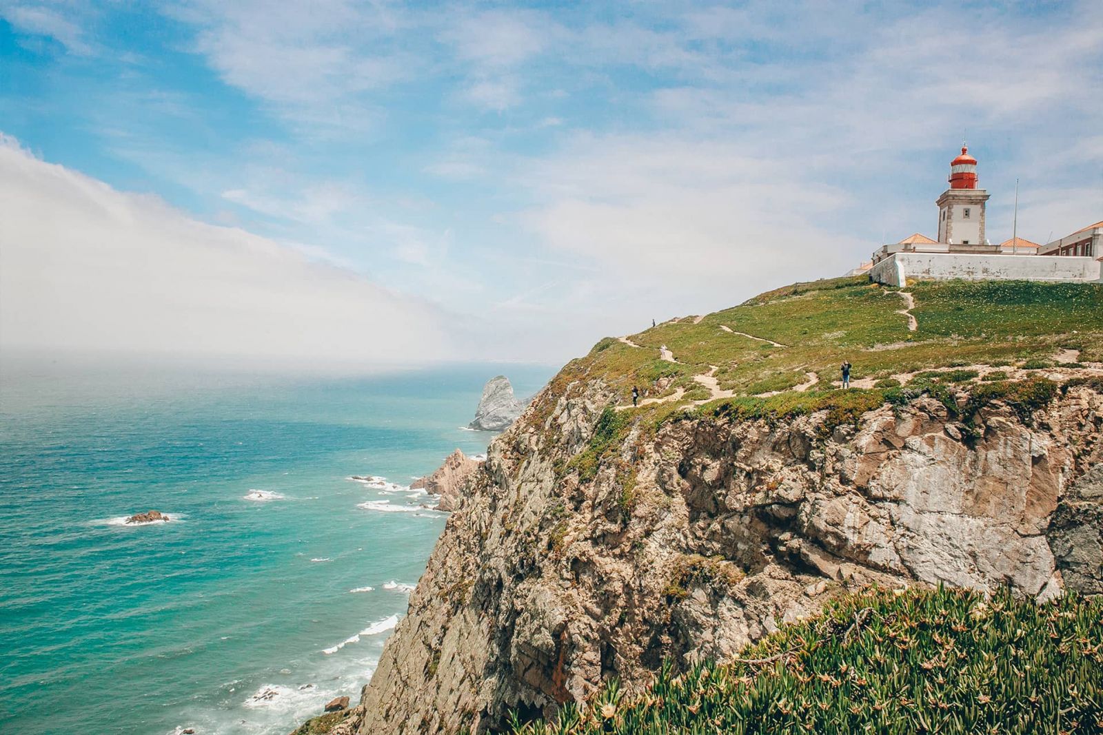 Lighthouse in Cabo da Roca by the cliffs.