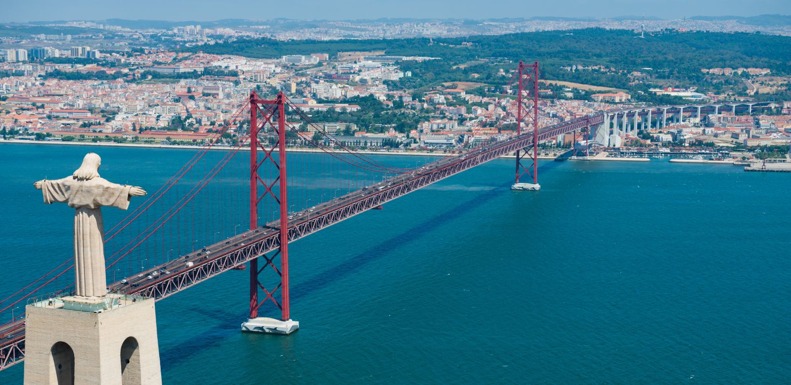 View of Ponte 25 de Abril bridge & Cristo Rei statue.