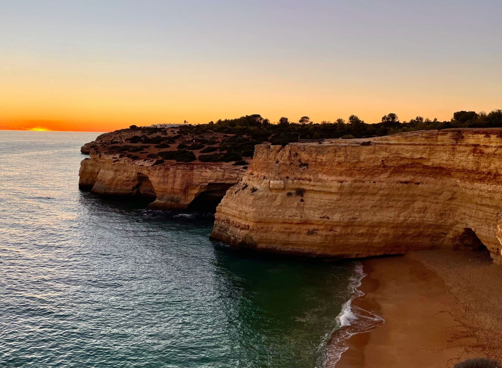 Sunset at a beach in Lagoa, Portugal.